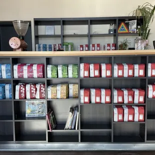 Bagged coffee beans are on display upfront