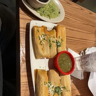 Six Pork Tamales with salsa verde black beans and cilantro rice