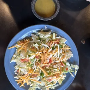 Side salad with vinaigrette dressing.