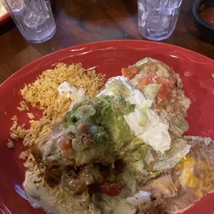 Chimichanga entree with rice and refried beans.
