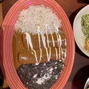 *BRISKET ENCHILADAS*  Three/two brisket enchiladas with chipotle wine  with jasmine rice and black beans.