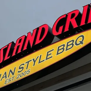 the neon sign for pac island grill