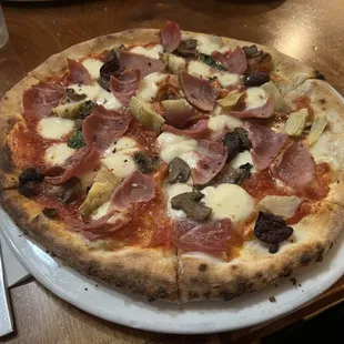 Capricciosa pizza. Ham, olives, artichokes, mushrooms, and basil. Lovely crust with a nice chew, and a yeasty, slightly fermented flavor.