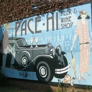 a vintage car painted on the side of a building