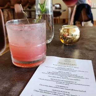 The Lady Lavender cocktail with a Borgona red wine infusion in the background. Impeccable!