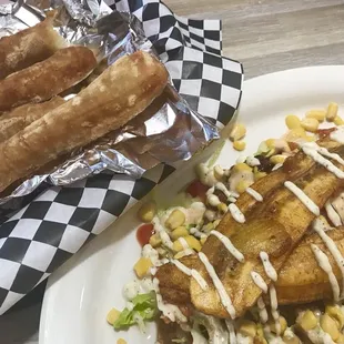 Tequenos(cheese sticks) Patacon (sweet plantain with shredded beef and chicken, lettuce, corn)