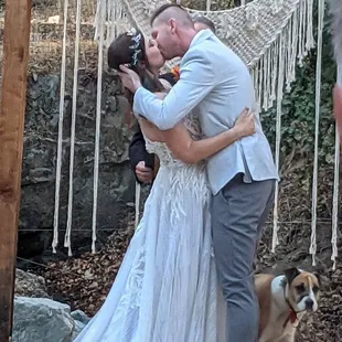 a bride and groom kissing