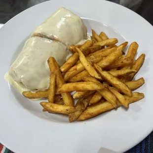 Burrito covered in queso