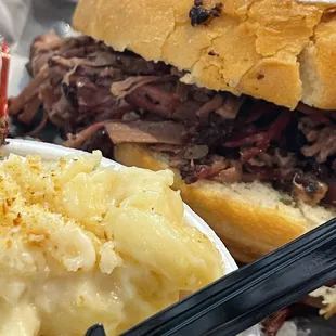 Chopped brisket sandwich with a side of Mac and cheese