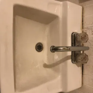 Disgusting. Seriously need this bathroom redone. It's from a horror movie