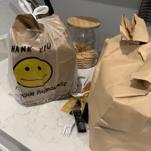 a paper bag with a smiley face on it