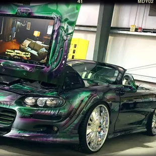 I&apos;m watching Melissa Mcarthy give Sandra Bullock the business on the hood of a Camaro... And I&apos;m trying super hard not to smile.