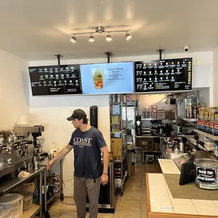 a man standing in a coffee shop