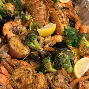 Lobster, crab, shrimp, mussels, clams, octopus, crawfish, sausage, quail eggs, potatoes, broccoli, mushrooms- a smorgasbord heaven!