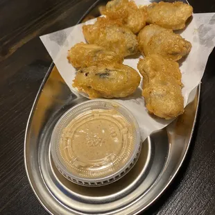 Fried oysters were greasy and kinda slimy sauce was strange too .