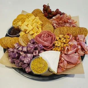 a platter of meat and cheeses