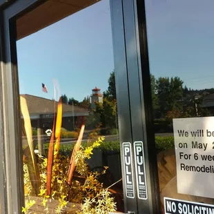 a closed sign in the window of a restaurant