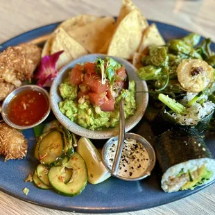 Pupu Platter $27- 4 coconut shrimp w/Thai chili sauce, 2 pork belly musubis, guaca-poke, blistered shishitos w/aioli, &amp;spicy cucumbers.