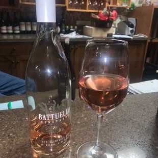 a bottle and a glass of wine