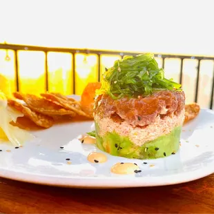 Ahi Poke tower ($24) crab, avocado, crispy wontons.