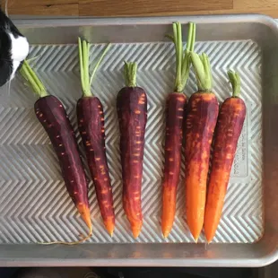 GORGEOUS purple carrots and my kitty's nose (these are our favorite veg to order)