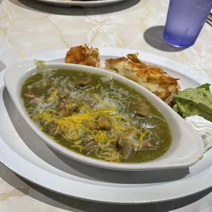 This is the Chili Verde breakfast, with two eggs, home potatoes, salsa, guacamole, sour cream and choice tortillas or bread. A must try!!!!