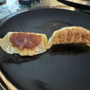 New potstickers likely from a bag. Slightly burnt.