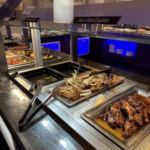 a variety of food in a buffet