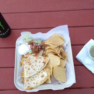 Cheese quesadilla, chips, sour cream, pico de gallo, salsa at the beach with live music $10!
