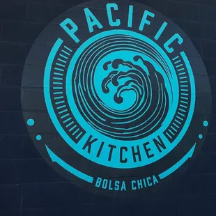 the logo on the side of a building