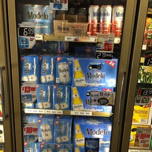a refrigerator full of sodas and soft drinks