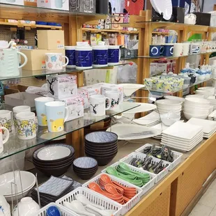 a wide selection of coffee cups and mugs