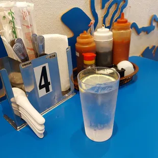 a glass of water and napkins