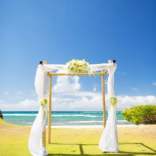 Bamboo Arch with shear white draping