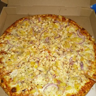 a pizza in a cardboard box