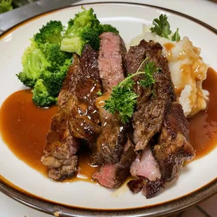 Ribeye steak, mashed potatoes, and steamed broccoli