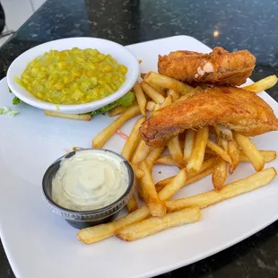 Salmon and chips with fries and curried corn