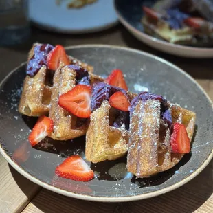 Waffle with blueberry cream and strawberries