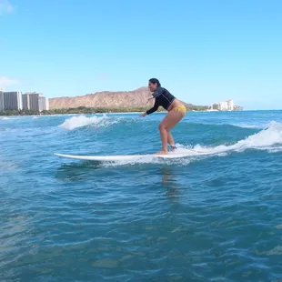 My daughter surfing on her first day