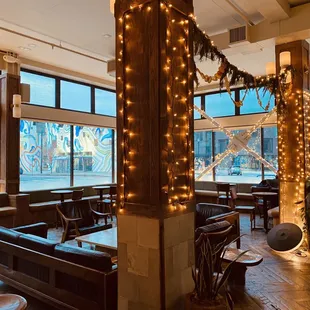 the interior of a restaurant decorated for christmas