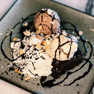 Warm Brownie Sundae with chocolate and vanilla ice cream, chocolate sauce, peanuts at Pacific Standard Prime steakhouse in Redondo Beach