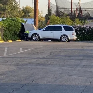 Homeless encampment beginning to spring up in the parking lot.