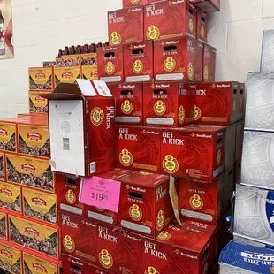 a large stack of boxes of beer