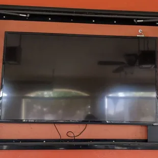 a flat screen tv mounted on a wall