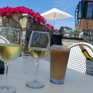 three glasses of wine on a table