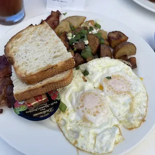Two eggs, Potatoes, Bacon, Sourdough Toast