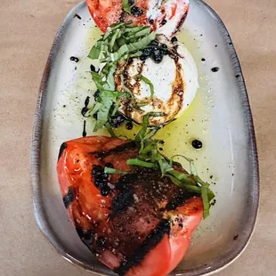 Tomatoes fresh mozzarella, basil, olive oil, balsamic pearls Delicious