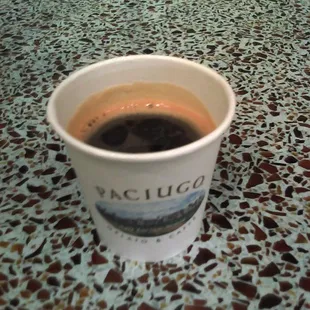 a cup of coffee on a counter