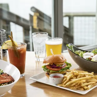 a plate of food and a bowl of fries