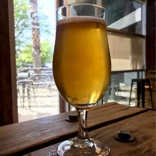a glass of beer on a table